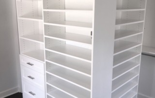 WALK IN CLOSET WHITE SHAKER OUTSIDE CORNER SHOE SHELVES